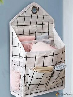 the hanging organizer is organized and ready to be used as a storage bin for baby's diapers