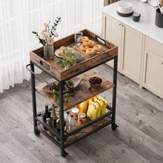 a kitchen cart with donuts and drinks on it