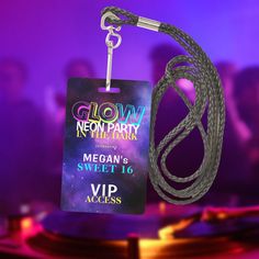 the glow neon party tag is hanging from a metal hook on a dj's turntable