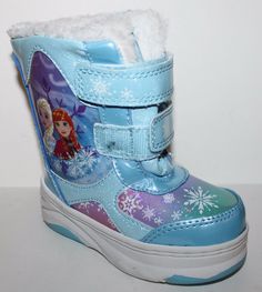 a pair of children's winter boots with snowflakes on the upper part