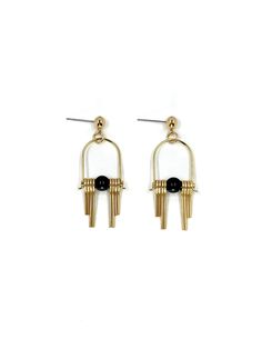 These Art Deco inspired earrings feature sleek, modern design elements, highlighting the contrast between the rich, dark hues of the black, semi precious Agate stone and the radiant golden brass. Each earring boasts a distinctive arched geometric shape inspired by the Art Deco style, lending a sense of elegance and sophistication.  The stepped cut brass fringe creates movement and shine and adds to the uniqueness and contemporary design.  Their minimalist yet bold design embodies a harmonious ba Modern Metal Linear Earrings For Evening, Modern Brass Earrings For Evening, Minimalist Black Linear Drop Earrings, Minimalist Black Drop Earrings, Modern Black Jewelry With Matching Earrings, Gold Onyx Drop Earrings, Modern Onyx Drop Earrings, Black Minimalist Metal Earrings, Modern Black Jewelry With Ear Wire