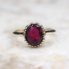 Vintage 14k gold ring with an oval-cut synthetic (lab-made) ruby set with fishtail prongs. Era: c.1960s Markings: 14k Materials: 14k gold, Synthetic ruby (8.25mm x 7.02mm x 3.09mm) Weight: 2.3 grams Ring Size: 5.5 (Comes with one free resizing by our jeweler) Condition: Good vintage condition. Some minor wear to the stone Shipping is free in the United States Follow us on Instagram @LUXXORVintage Ruby Solitaire Ring, Ruby Set, 14k Gold Ring, Solitaire Ring, Rings Statement, Oval Cut, Gold Ring, Statement Rings, Vintage Inspired