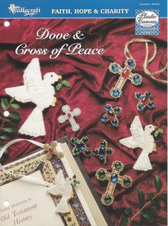 the front cover of a book with cross and doves on it, surrounded by other items