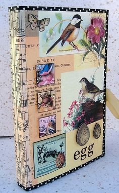 an altered book with birds and flowers on it