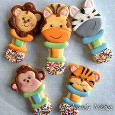 decorated cookies in the shape of animals and zebras