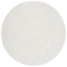 a white circular rug with an intricate design on the center and bottom, against a white background