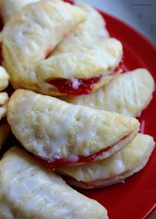 several pastries are arranged on a red plate