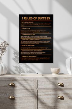 the seven rules of success poster on a dresser