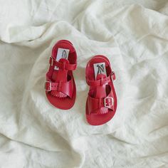 Our Stevie Sandal is a modern interpretation of a classic summer staple. It features a durable leather upper and metal buckles. We've added a versatile fringe t-strap that allows you to change the look of the sandal. The combination of a breathable leather insole and a textured white crepe sole make for a shoe that's light and flexible while giving your little one lots of traction for exploring. Perfect for any summer adventure! Summer Adventures, Summer Staples, T Strap, Metal Buckles, Natural Leather, Full Grain Leather, Little One, Adjustable Straps, Leather Upper