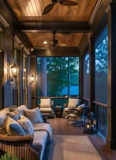 a covered porch with wicker furniture and ceiling fan