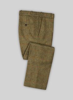 Make a debonair style statement in the Harris Tweed Country Brown Check pants. Crafted from pure wool, the check fabric brings an extra dose of interest giving a unique flair to the classic style. Pair it with a matching jacket and waistcoat, a white shirt and brown derby shoes. 
 
 Look Includes  Harris Tweed Country Brown Check Fabric  Cross Pocket  Flat Front  Two Welted Back Pockets on Trousers   
 You can change the look during customization if required. 
 
Lining: Viscose; Dry Clean. Grey Tweed Suit, Herringbone Tweed Jacket, White Linen Suit, Green Velvet Jacket, Peaky Blinders Suit, Tweed Run, Brown Derby, Royal Blue Suit, Fabric Cross