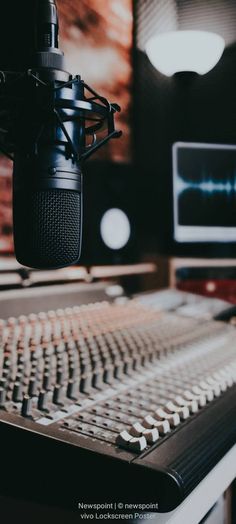 a recording studio with a microphone and sound board