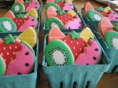 many decorated cookies in baskets on a table