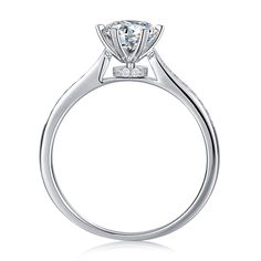 a white gold engagement ring with an oval cut diamond in the center and side stones