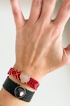 Moonstone Anadara on Jaipur Flamingo Bracelet from Dezso by Sara Beltran Hand-carved moonstone anadara shell, set in 18K gold Bright pink & red nylon woven bracelet Button and loop closure Bracelet length: 6 1/2", width 1/2" Hand-carved in India Traditional Jewelry With Sliding Knot For The Beach, Adjustable Red Handwoven Bracelets, Adjustable Red Handwoven Bracelet, Red Handwoven Beach Jewelry, Flamingo Bracelet, Woven Bracelet, Woven Bracelets, Jaipur, Bright Pink