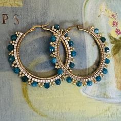 Large Hoop Earrings featuring beautiful Blue Apatite gemstones and Seed Beads Large hoop earrings made with bright, colorful gemstones and gold and silver seed beads. These beautiful earrings capture the colors of a gorgeous blue sky. The will surely make a bold statement. The snap hoop earwires and findings are gold plated stainless steel and hypoallergenic.   These large very lightweight earrings measure 2 inches  total.   Great for anytime and the perfect jewelry gift. You will absolutely love the color and sparkle of these statement earrings.  Thanks for looking and please stop by again. Bead Tips, Blue Apatite, Large Hoop Earrings, Light Weight Earrings, Bead Jewellery, Diy Earrings, Jewelry Earrings Hoops, Gemstone Colors, Artisan Jewelry