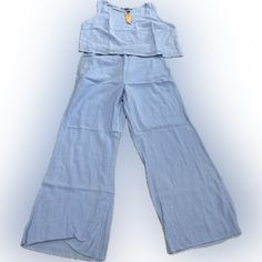 Women’s 2pc Pants Suite. Wide Legs. Sleeveless. Light Blue. Large. Casual Cotton Wide Leg Sets, Casual Matching Set With Wide Leg, Casual Wide Leg Matching Set, Sleeveless Blue Vacation Set, Casual Sleeveless Matching Set Bottoms, Spring Cotton Matching Set Bottoms, Casual Matching Set Bottoms, Casual Two-piece Pants For Vacation, Casual Wide Leg Sets For Day Out