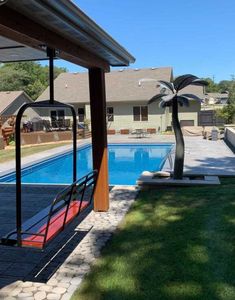 an empty swimming pool in the middle of a yard