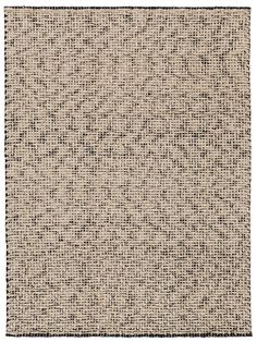 an area rug with black and white dots on it, in the shape of squares