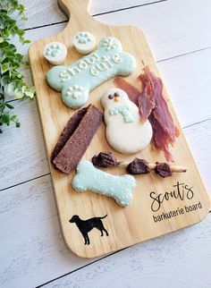 a wooden cutting board topped with different types of food