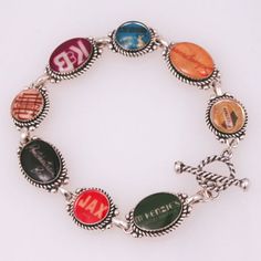 a bracelet with different colored charms on it