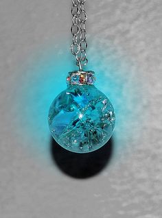 an image of a blue glass ball on a chain