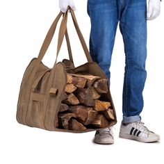 a man holding a bag full of logs in front of his back legs and hands