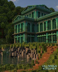 a large green building sitting on top of a lush green hillside next to a body of water