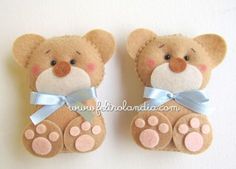 two brown teddy bears with pink paws and blue ribbon on their feet, one is wearing a bow