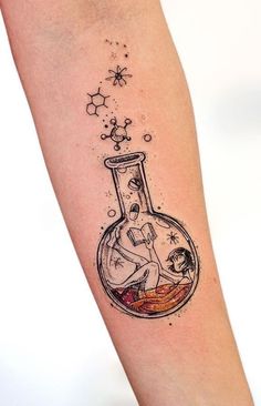 a tattoo on the arm of a woman with an image of a man in a bottle