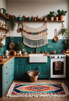 a kitchen with green walls and colorful rugs on the floor, pot racks above the stove