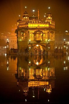 the golden temple in amrit, india at night royalty photo - free stock image