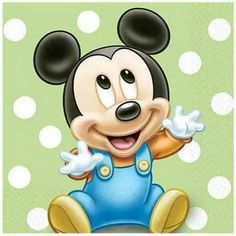 a cartoon mickey mouse sitting on top of a polka dot covered ground with his arms out