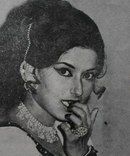 an old black and white photo of a woman with her hand on her mouth, wearing jewelry