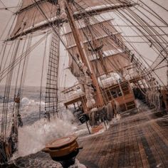 an old photo of a ship in the ocean with waves crashing on it's deck