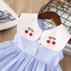 Product Title: Girls Lapel Striped Dress Sleeveless Cherry Embroidered Princess DressKeyword Tag: Bulk Toddler Socks*Pattern: Fruit*Soft Feeling & Cozy Comfortable* Available for Machine Wash as well as TumbleDry* Imported Are you look for a best quality and affordable dress? Then Girls Lapel Striped Dress Sleeveless Cherry Embroidered Princess Dress is the best one for you! The New style with amazing designs for reflect fashion vibes that will embrace you the moment you wear them. The pattern o Cute Doll Collar Dresses For Summer, Cute Doll Collar Summer Dresses, Cute Summer Dresses With Doll Collar, Blue Doll Collar Summer Dress, Blue Summer Dress With Doll Collar, Playful Doll Collar Summer Dress, Playful Summer Dress With Doll Collar, Summer Embroidered Dress With Doll Collar, Playful Blue Sleeveless Summer Dress