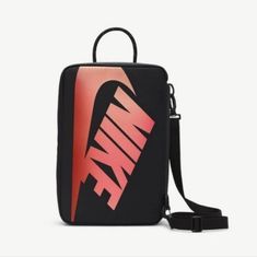 Made With Durable Materials, The Main Body Features 2 Large Nike Logos, A Removable Crossbody Strap And A True Shoebox Flap Opening. On The Inside, An Internal Elastic Pocket And Zippered Mesh Pocket Help Keep Extra Laces And Other Small Items Stored And Organized. 14' L X 9'' W X 5" H 12 L 100% Polyester Shown: Black/Black/University Red Red Nike School Bag, Nike Red Travel Bag, Red Nike Travel Bag, Black Nike Bag With Adjustable Strap, Nike Black Bag With Zipper Closure, Nike Rectangular Everyday Bags, Nike Everyday Rectangular Shoulder Bag, Nike Rectangular Shoulder Bag For Travel, Trendy Nike Travel Bag