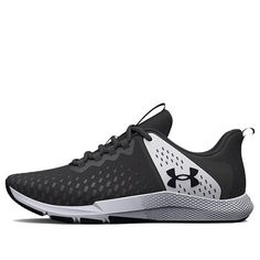 the under armour shoes are black and white with grey details on the upper part of the shoe