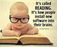 a baby wearing glasses reading a book with the caption it's called reading it's how people install new software into their brain