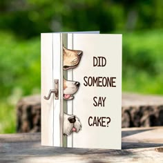 a card that says did someone say cake? with two dogs peeking out from behind a door