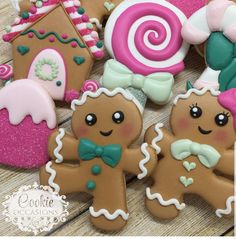 several decorated cookies on a wooden table