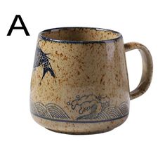 a ceramic mug with blue and white designs on the inside, sitting in front of a white background