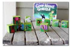 the wooden blocks have pictures of animals on them and are next to a good night gorilla game