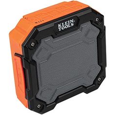 an orange and black speaker sitting on top of a white surface with the words kleen tools written on it