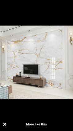 a living room with marble walls and flooring in white, gold and black colors