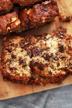 two slices of chocolate chip banana bread on a cutting board