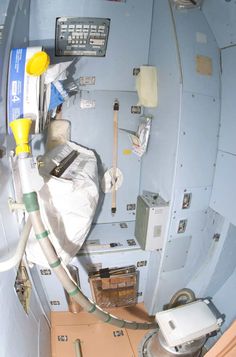 the inside of a space shuttle with electronic equipment on it's walls and floor