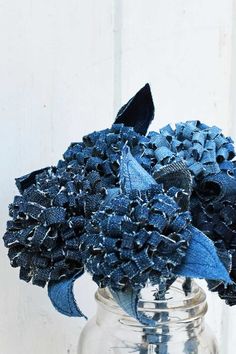 a vase filled with blue flowers on top of a table