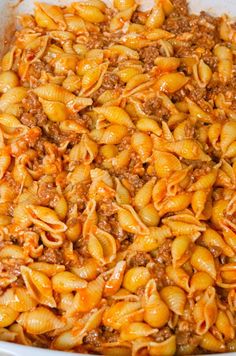 a casserole dish filled with ground beef and pasta