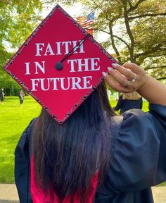 a woman wearing a graduation cap that says faith in the future